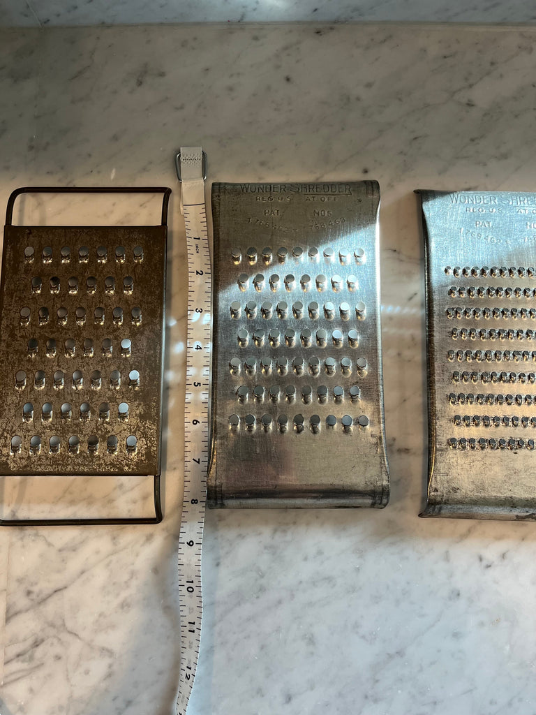 vintage tin cheese graters